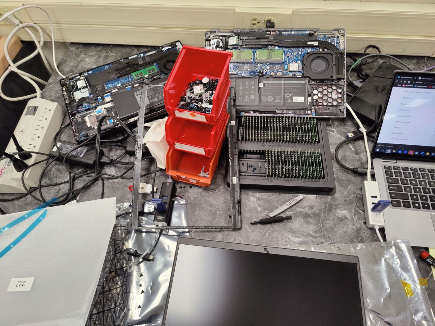 Laptop opened for RAM replacement on the repair bench