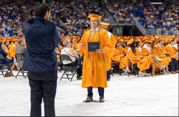 Brian receiving his high school diploma